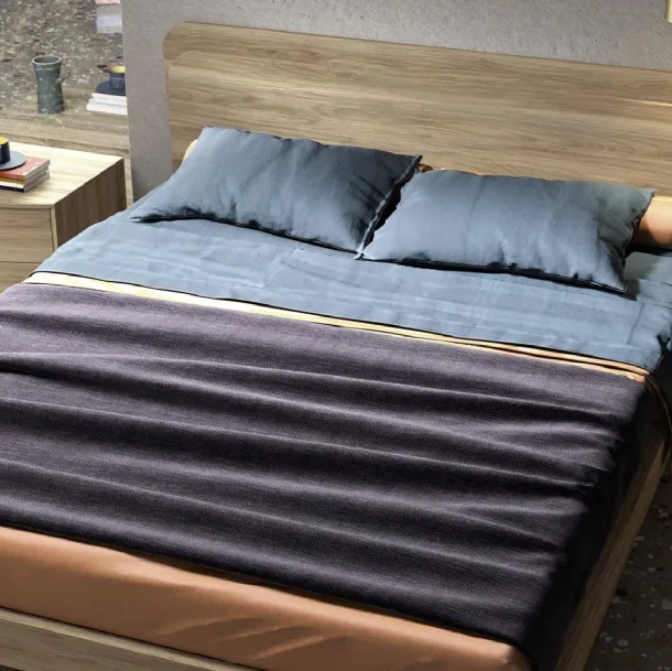 Letto in essenza legno con testiera Glow di Mab